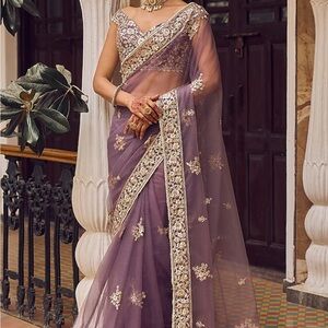 Elegant Purple Saree with Gold Embellishments